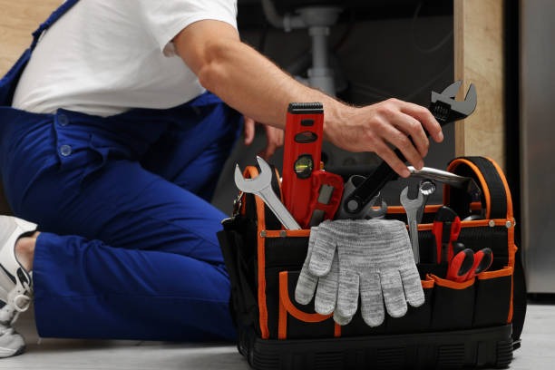 Master plumber on service call with specialized tools